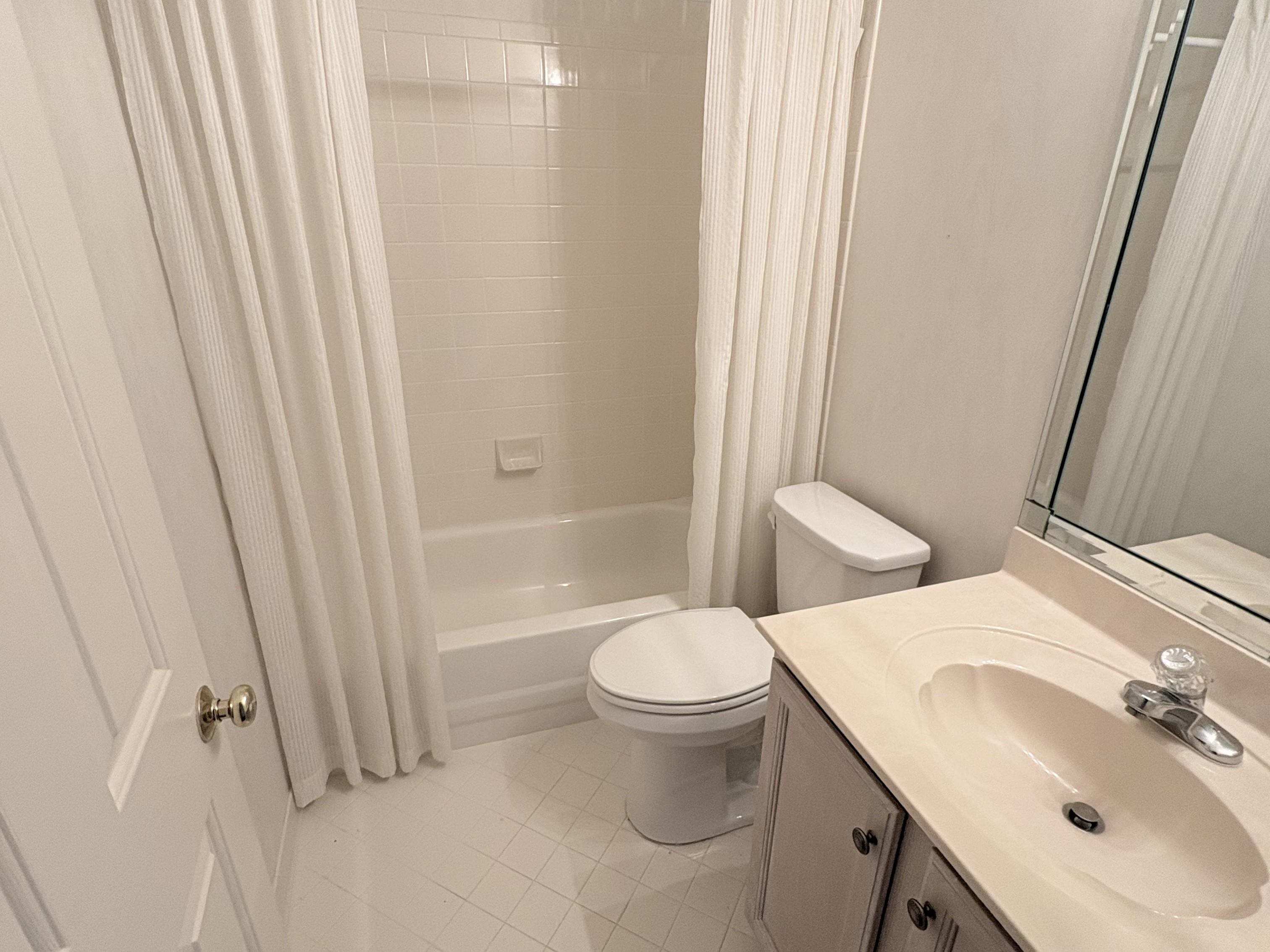 1740 Constable Court Collierville, TN 38017 - Photo 14 of 17 Bathroom with shower / tub combo with curtain, vanity, and light tile patterned floors