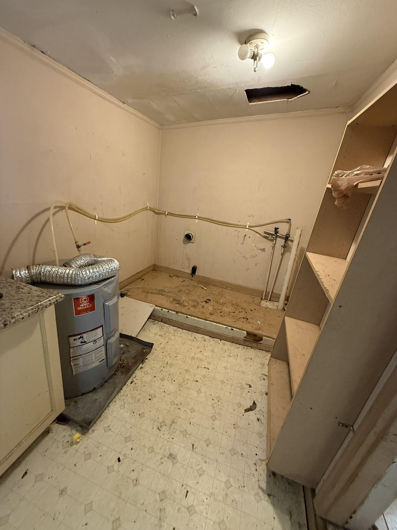 8488 Quito Road Millington, TN 38053 - Photo 18 of 30 a utility room with cabinets