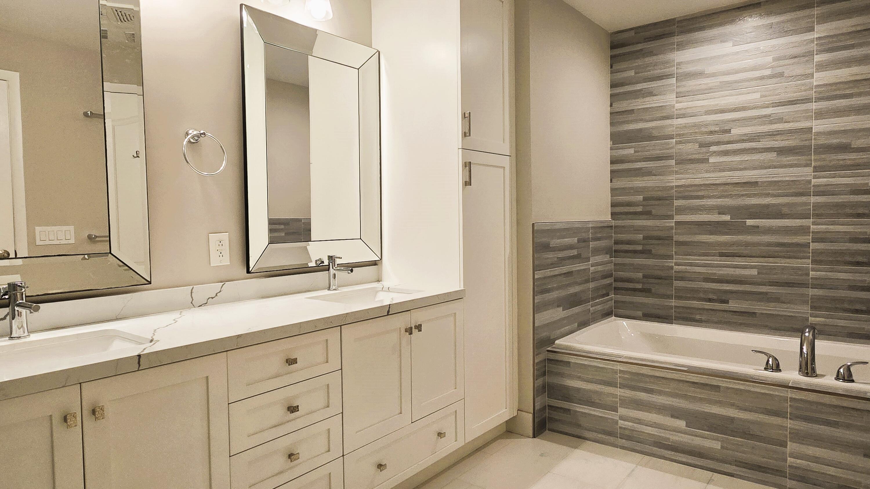 410 Evernia Street, Unit 701 West Palm Beach, FL 33401 - Photo 11 of 29 a bathroom with a bathtub and a sink