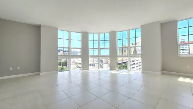 a room with natural light and a large window