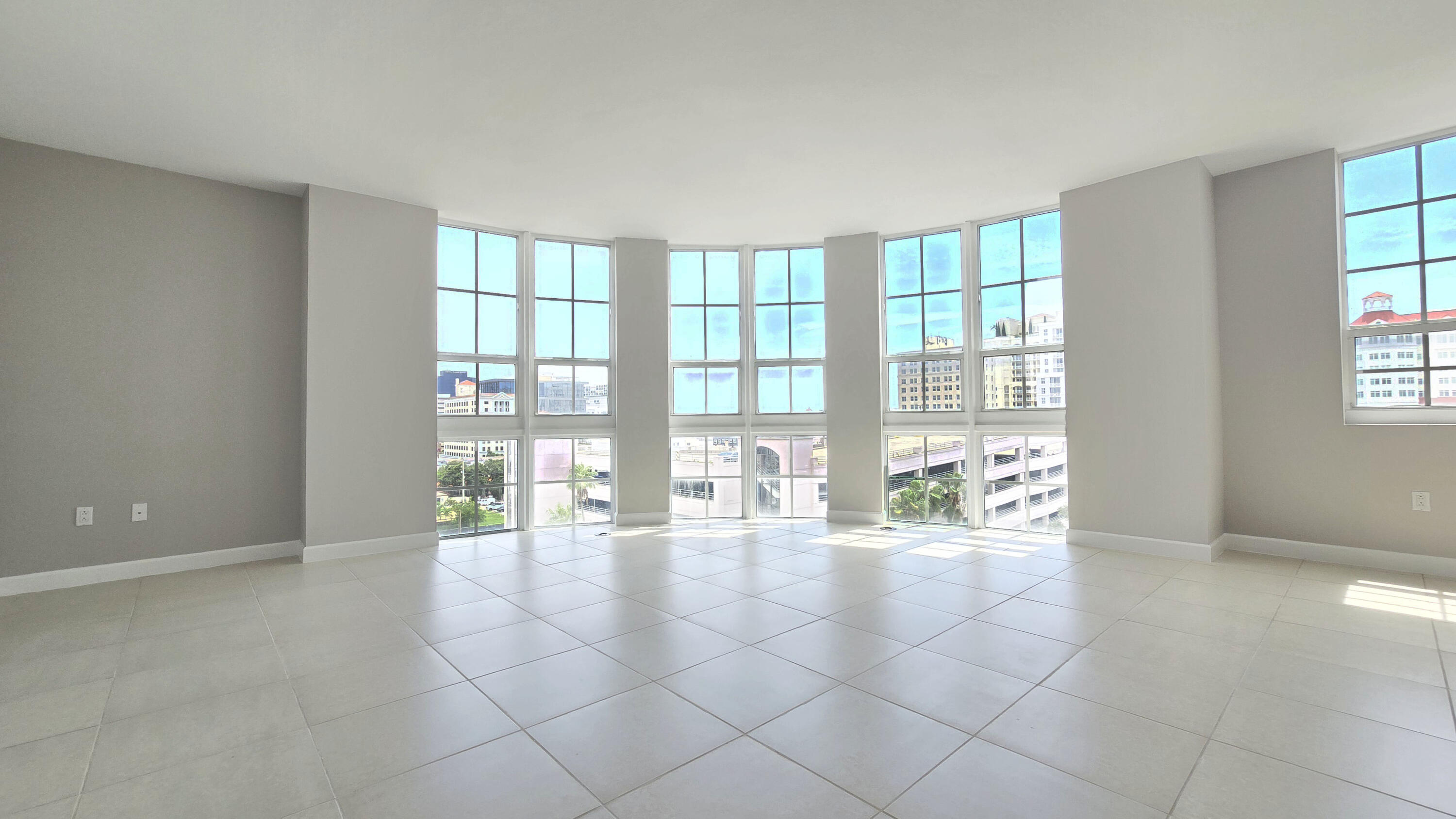 410 Evernia Street, Unit 701 West Palm Beach, FL 33401 - Photo 3 of 29 a room with natural light and a large window