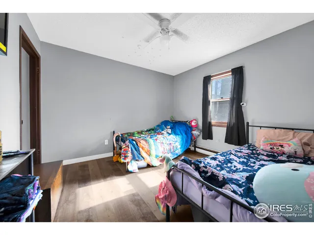 a bedroom with a bed and dresser