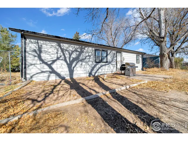 a view of a backyard with a patio