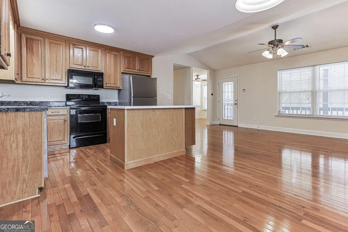30 Chancel Circle, Unit 654R Ellijay, GA 30540 - Photo 13 of 44 a kitchen with wooden floors and appliances