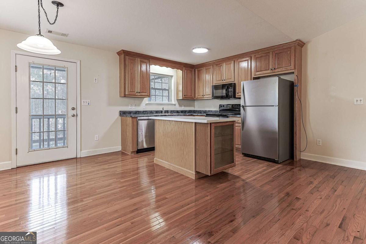 30 Chancel Circle, Unit 654R Ellijay, GA 30540 - Photo 14 of 44 a kitchen with stainless steel appliances granite countertop a refrigerator a stove a sink and a microwave