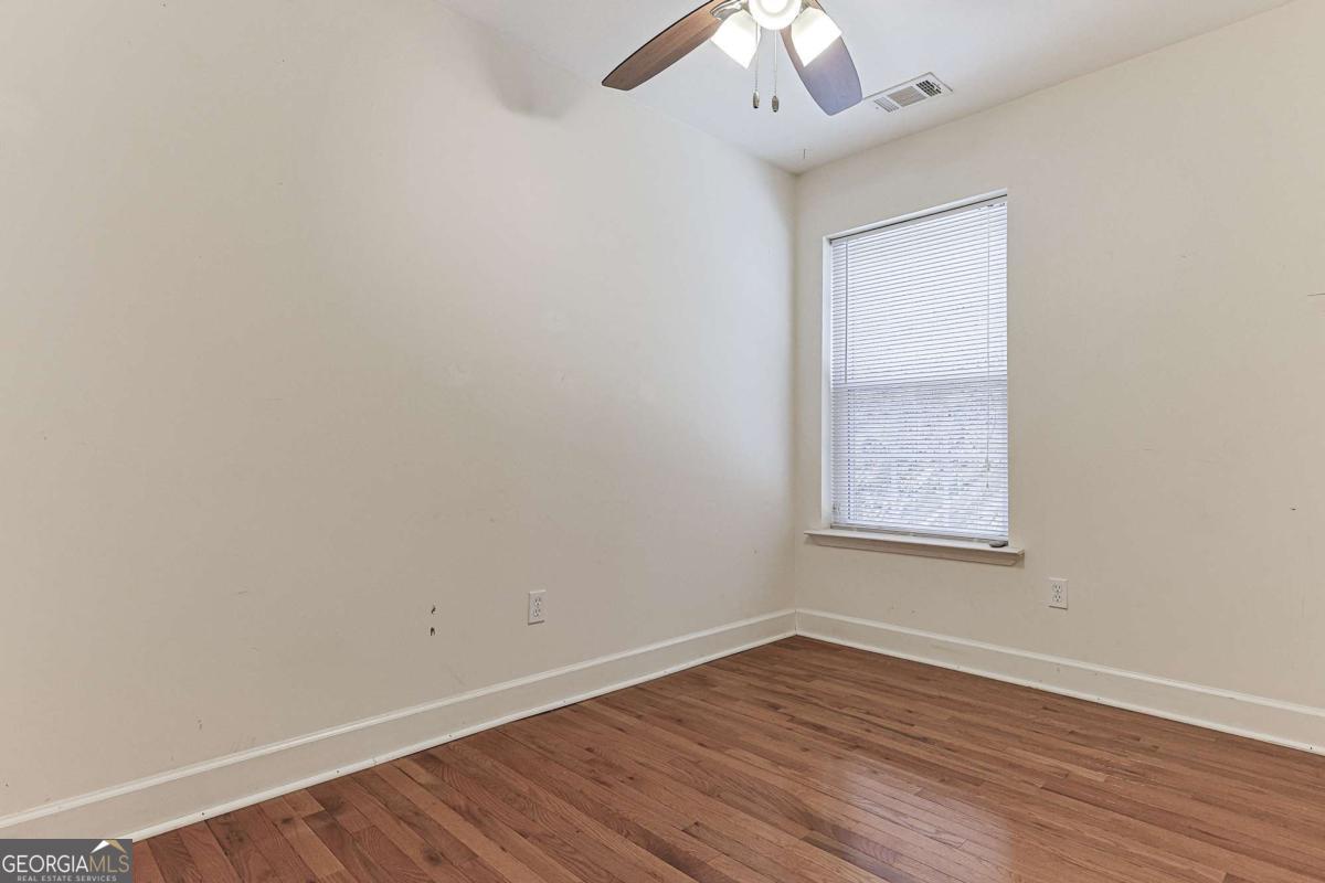 30 Chancel Circle, Unit 654R Ellijay, GA 30540 - Photo 26 of 44 an empty room with wooden floor and windows