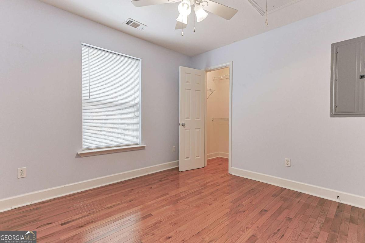 30 Chancel Circle, Unit 654R Ellijay, GA 30540 - Photo 31 of 44 an empty room with wooden floor and windows