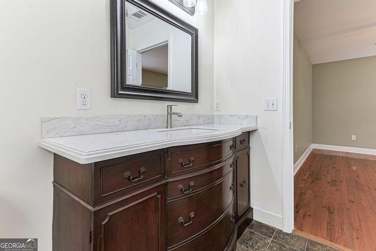 30 Chancel Circle, Unit 654R Ellijay, GA 30540 - Photo 35 of 44 a bathroom with a sink and a mirror