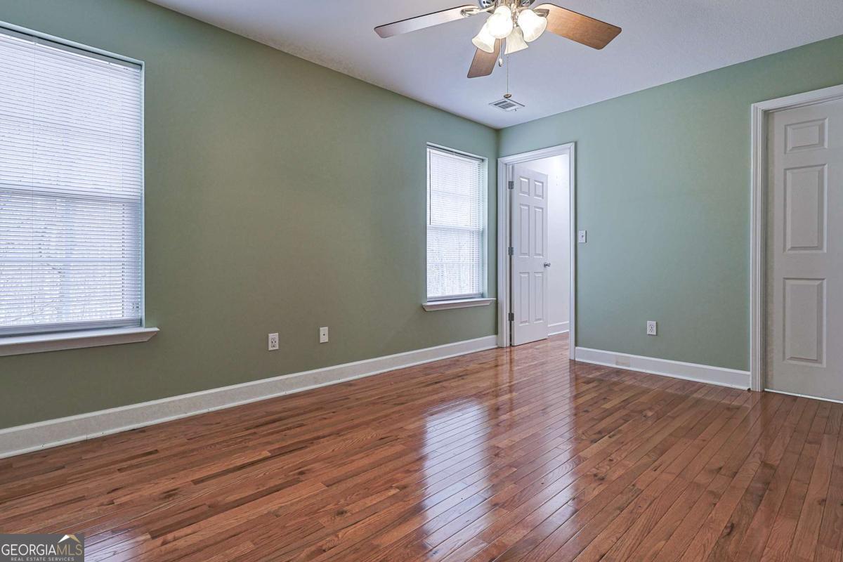30 Chancel Circle, Unit 654R Ellijay, GA 30540 - Photo 40 of 44 an empty room with wooden floor and windows