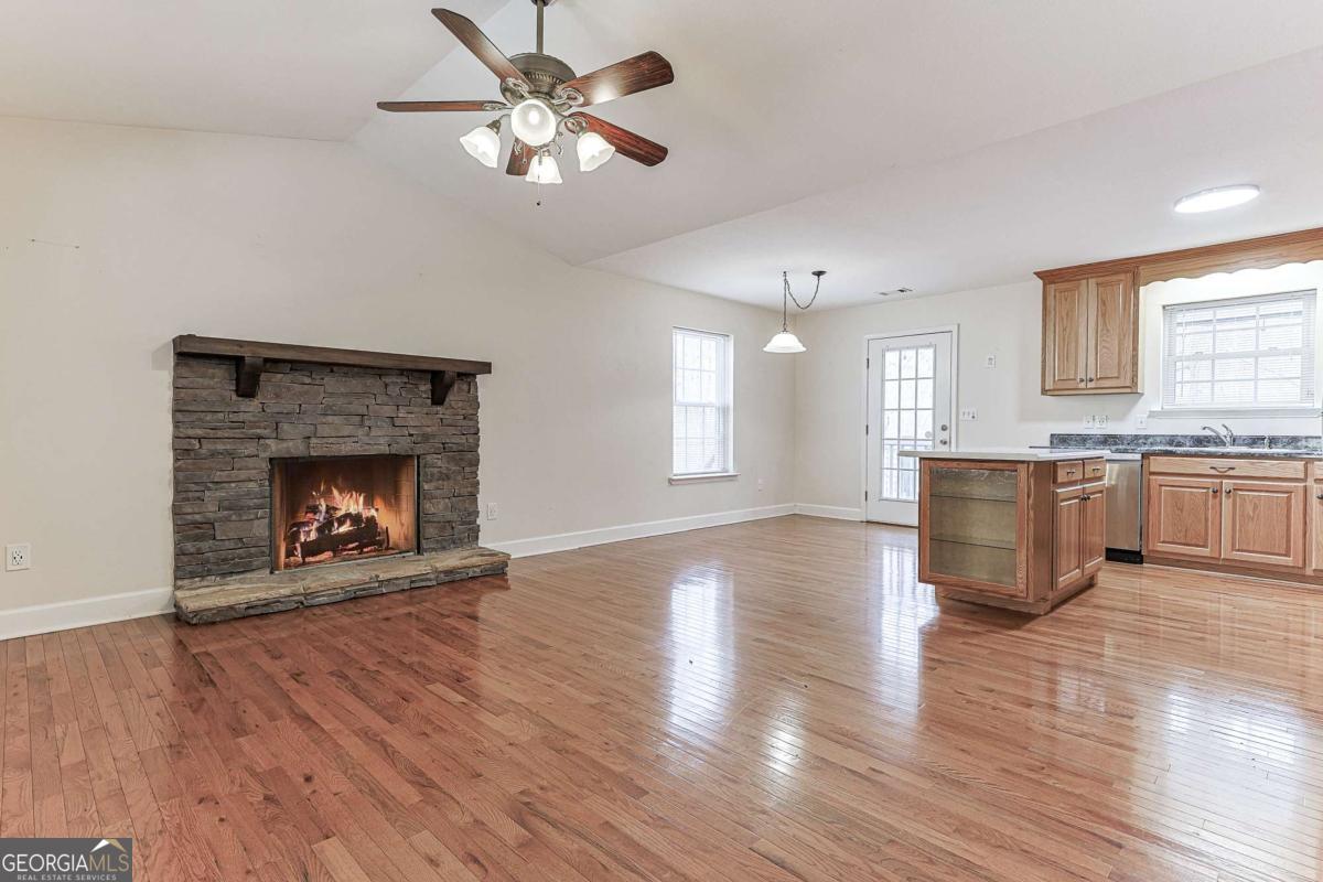 30 Chancel Circle, Unit 654R Ellijay, GA 30540 - Photo 4 of 44 a view of an empty room with a fireplace and a window