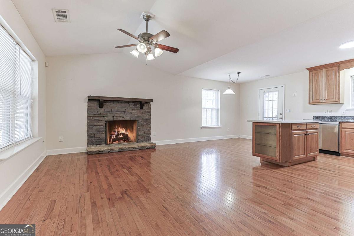 30 Chancel Circle, Unit 654R Ellijay, GA 30540 - Photo 9 of 44 a view of an empty room with a window and wooden floor