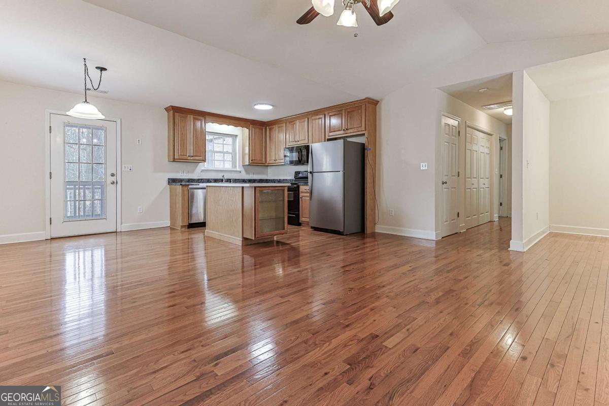 30 Chancel Circle, Unit 654R Ellijay, GA 30540 - Photo 10 of 44 a view of a kitchen center island wooden floor and stainless steel appliances