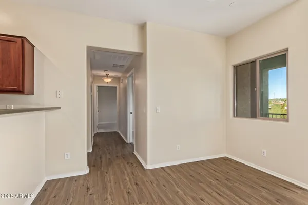 a bathroom with a painting on the wall