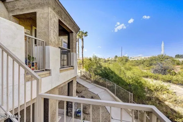 a view of a swimming pool with a lounge chairs