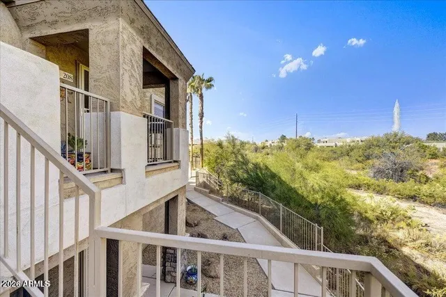 a view of a swimming pool with a lounge chairs