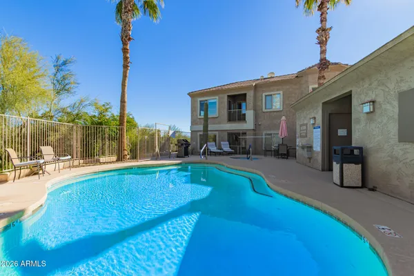 a view of a building with potted plants