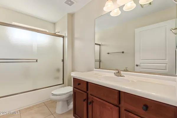 an empty room with a bathroom