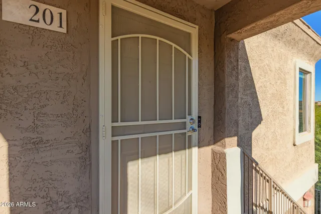 a view of a large building with mountains in the background