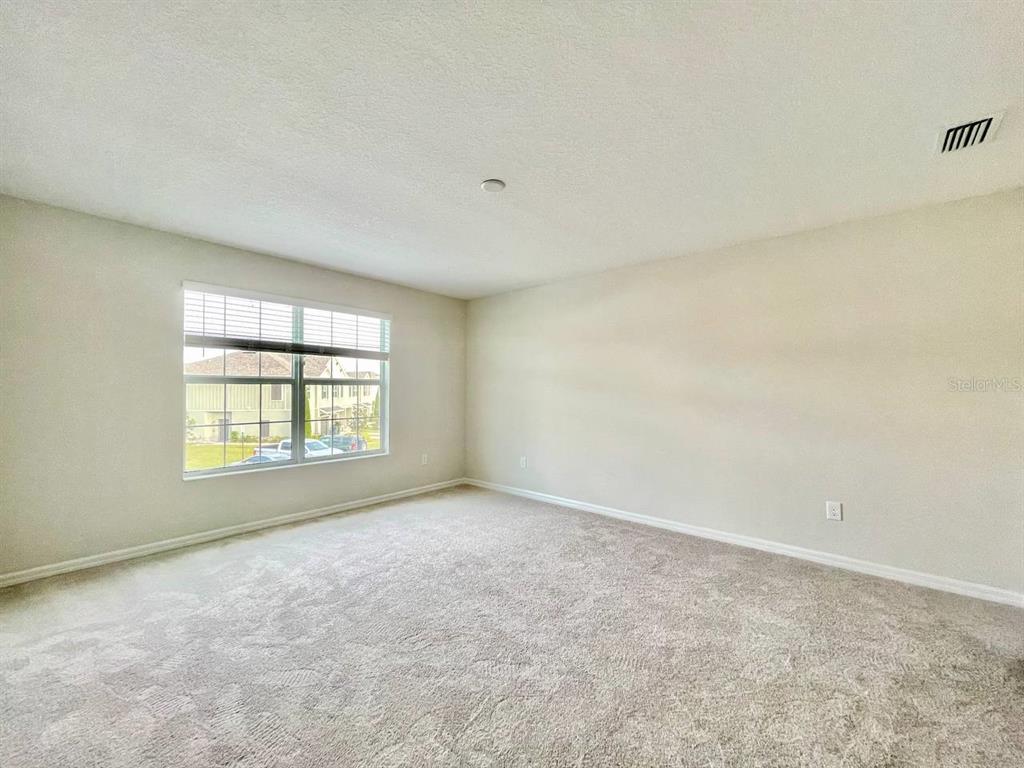 9689 Sweetwell Place Riverview, FL 33569 - Photo 15 of 33 an empty room with a window
