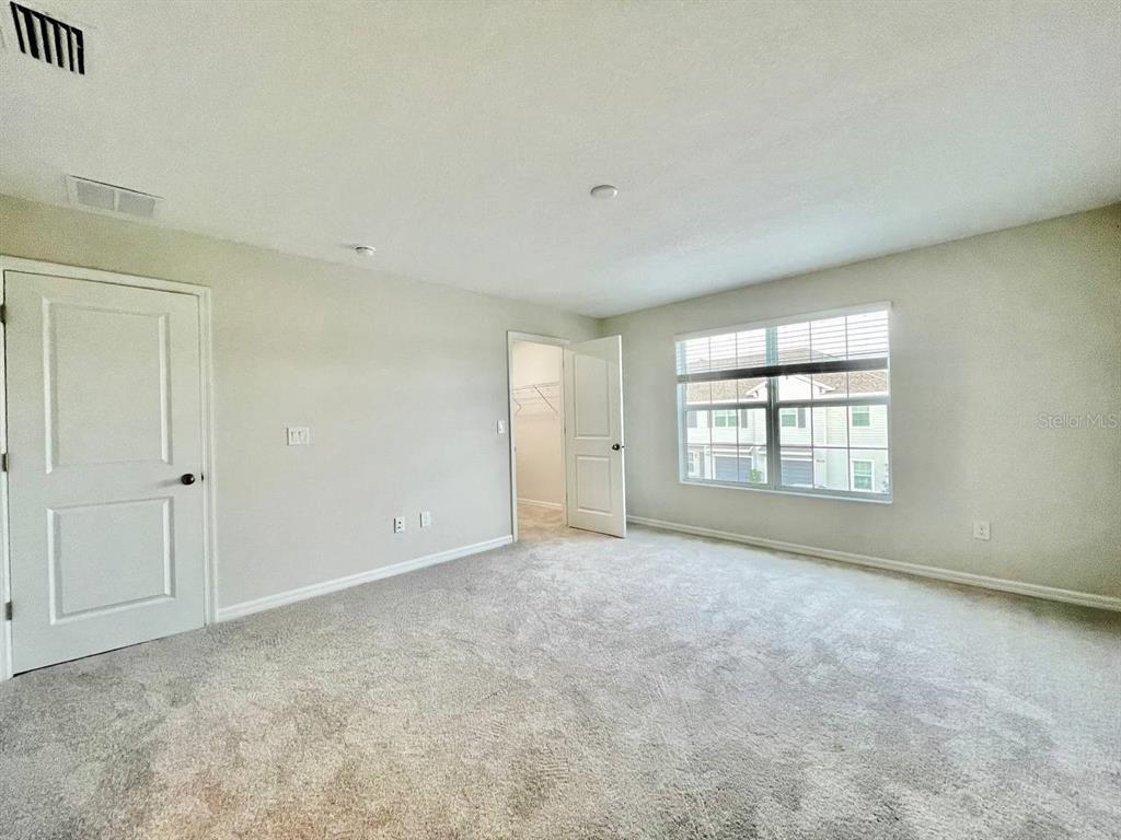9689 Sweetwell Place Riverview, FL 33569 - Photo 16 of 33 a view of an empty room with a window