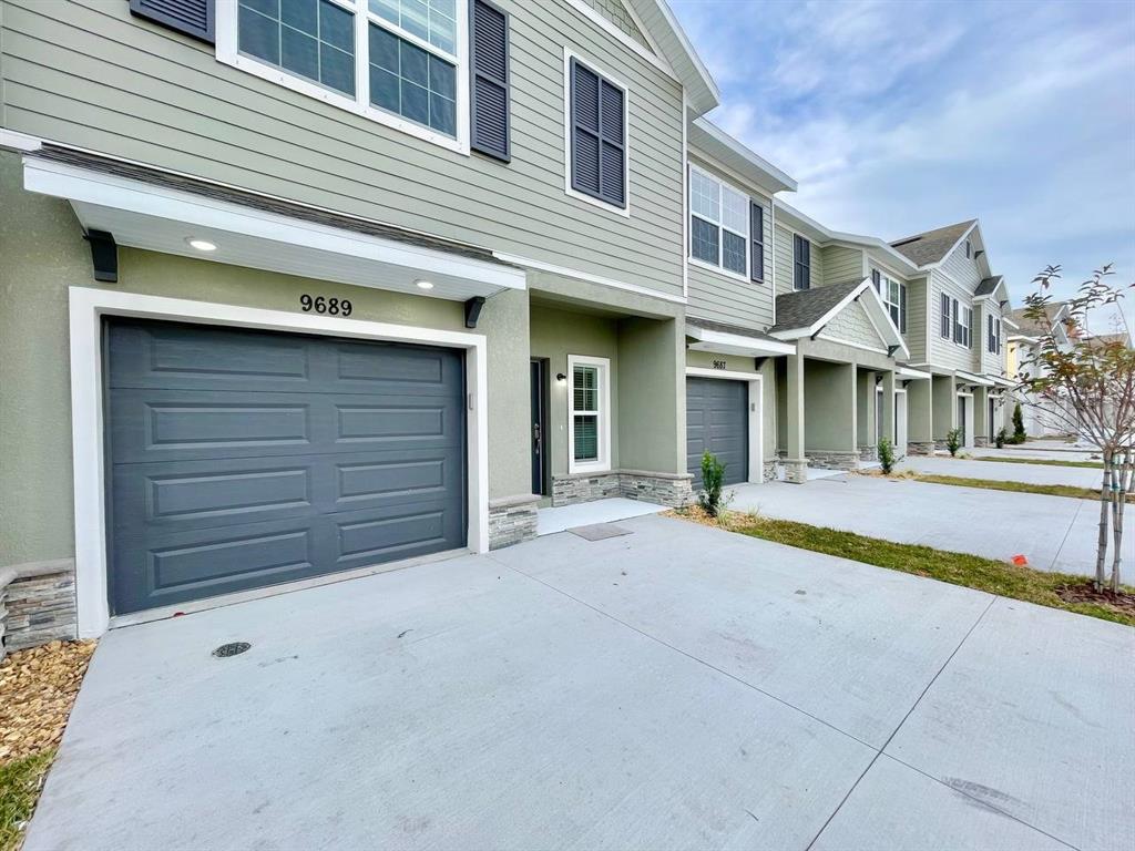 9689 Sweetwell Place Riverview, FL 33569 - Photo 2 of 33 a view of a house with a patio