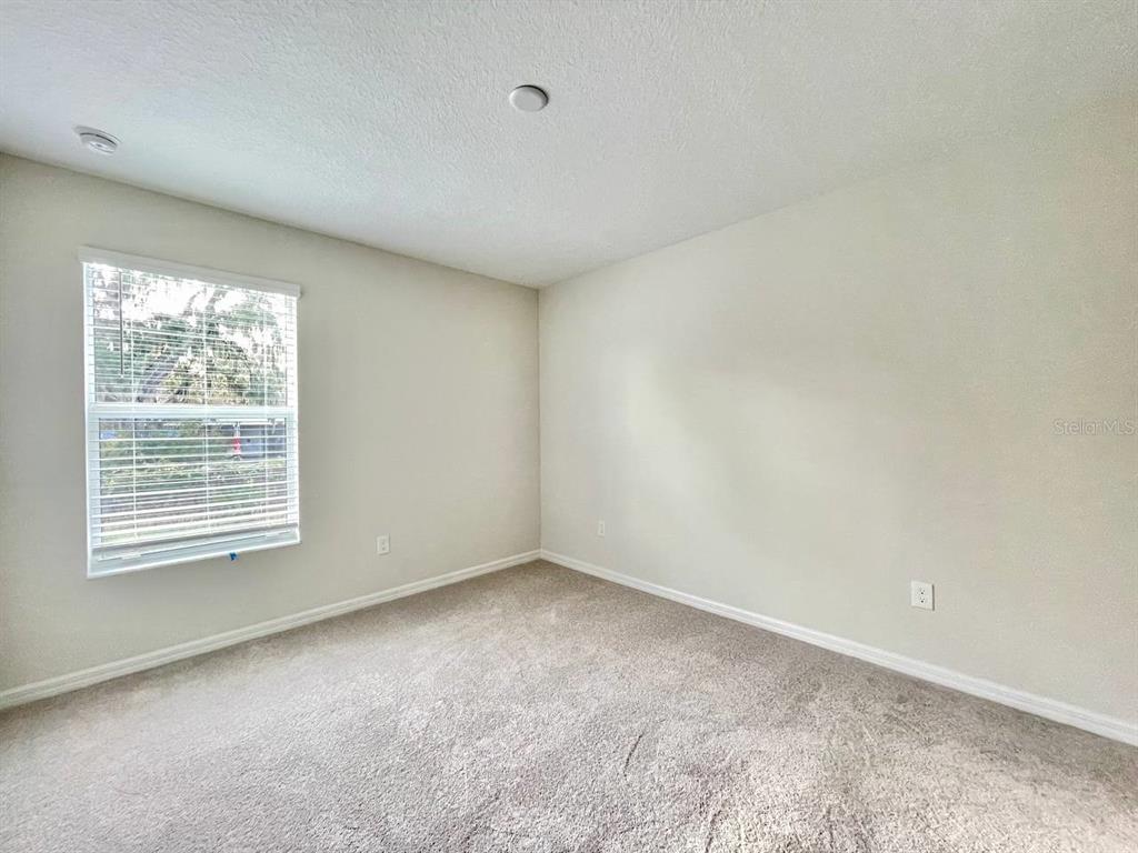 9689 Sweetwell Place Riverview, FL 33569 - Photo 21 of 33 an empty room with a window