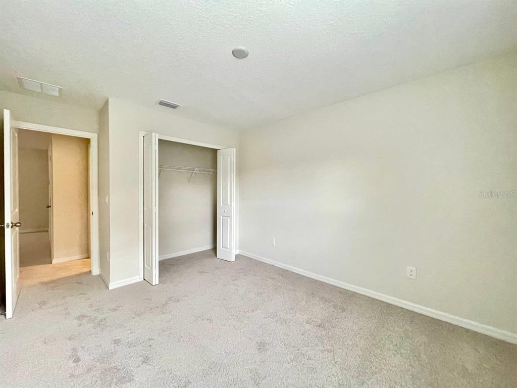 9689 Sweetwell Place Riverview, FL 33569 - Photo 25 of 33 a view of an empty room and closet area