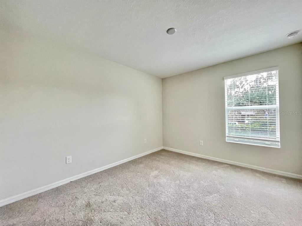 9689 Sweetwell Place Riverview, FL 33569 - Photo 26 of 33 an empty room with a window
