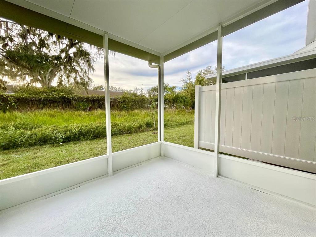 9689 Sweetwell Place Riverview, FL 33569 - Photo 28 of 33 a view of empty room with floor to ceiling window