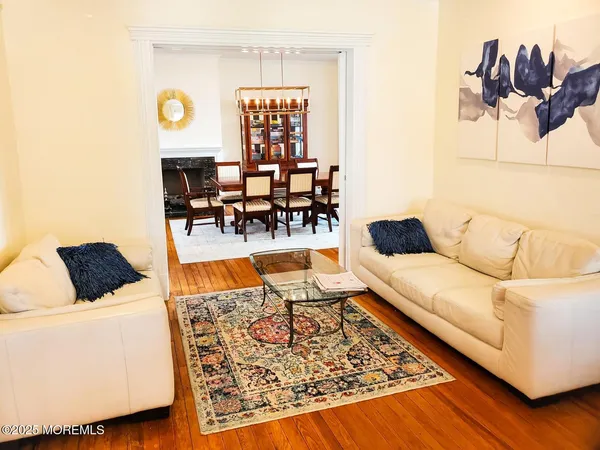 a living room with furniture and a rug
