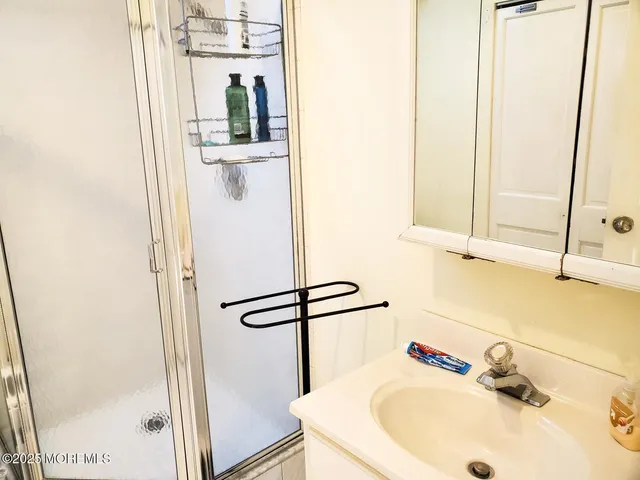 a bathroom with a sink and mirror