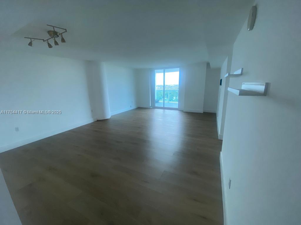 a view of a room with window and a fireplace