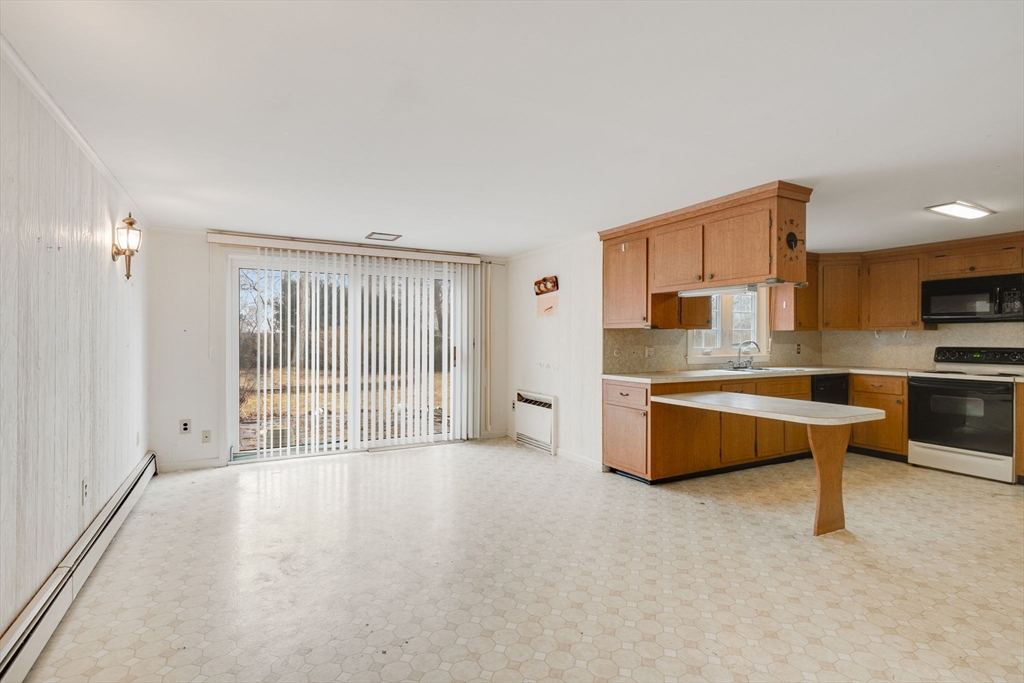 48 Murphy Road Hyannis, MA 02601 - Photo 9 of 31 a large kitchen with a sink and a large window