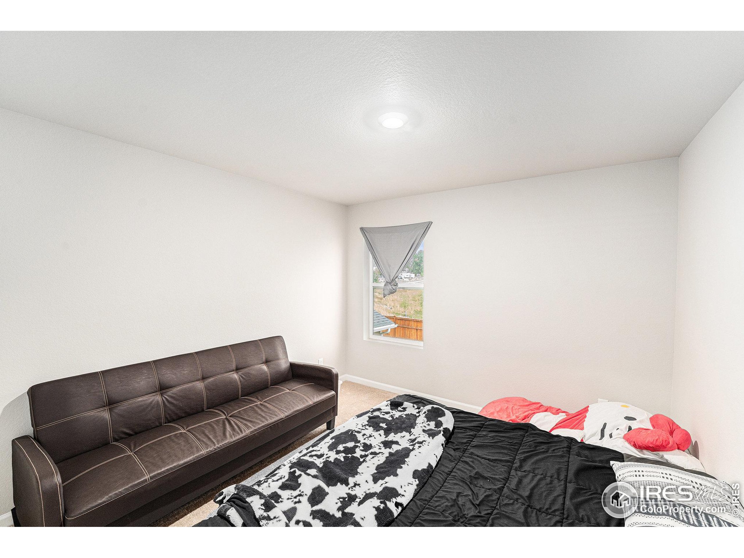 971 Ouzel Falls Road Severance, CO 80550 - Photo 12 of 16 a living room with furniture and wooden floor