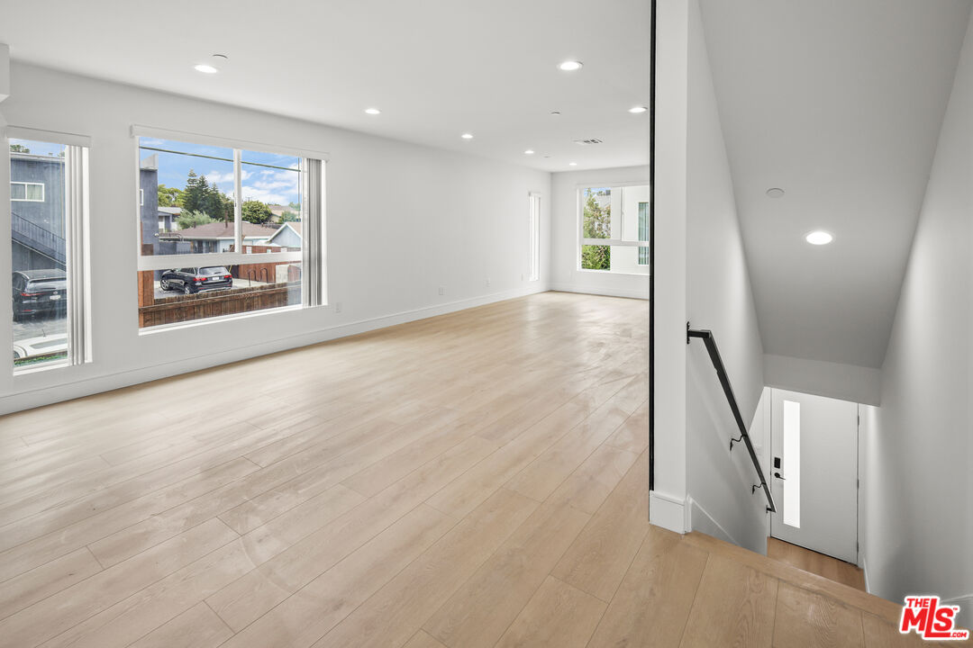 2700 Fletcher Drive, Unit A Los Angeles, CA 90039 - Photo 12 of 33 a view of an empty room with wooden floor and a window
