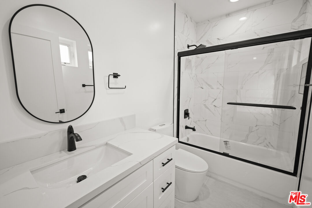 2700 Fletcher Drive, Unit A Los Angeles, CA 90039 - Photo 17 of 33 a bathroom with a sink a toilet and a mirror