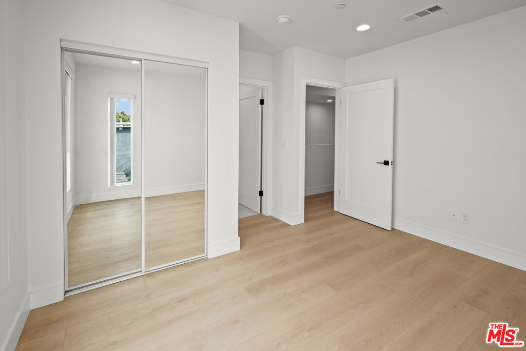 2700 Fletcher Drive, Unit A Los Angeles, CA 90039 - Photo 22 of 33 an empty room with closet and wooden floor