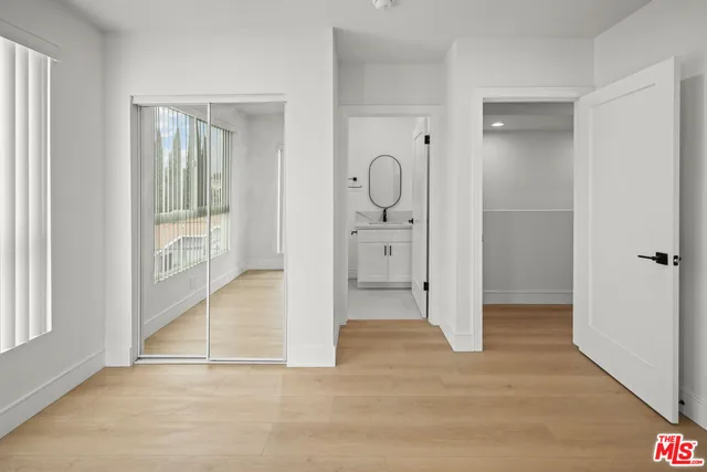 a view of a bathroom with sink and shower