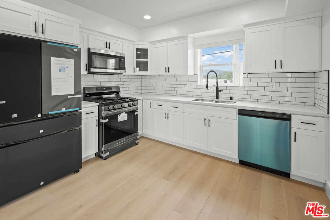 2700 Fletcher Drive, Unit A Los Angeles, CA 90039 - Photo 3 of 33 a kitchen with a sink stove and refrigerator