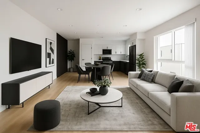 a living room with furniture a rug and a flat screen tv