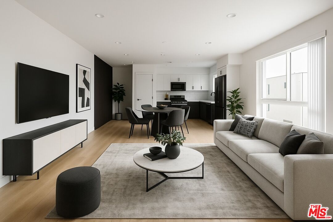 2700 Fletcher Drive, Unit A Los Angeles, CA 90039 - Photo 5 of 33 a living room with furniture a rug and a flat screen tv