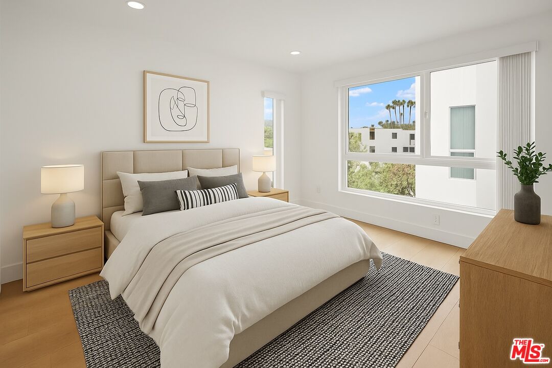 2700 Fletcher Drive, Unit A Los Angeles, CA 90039 - Photo 7 of 33 a bedroom with a large bed and a window