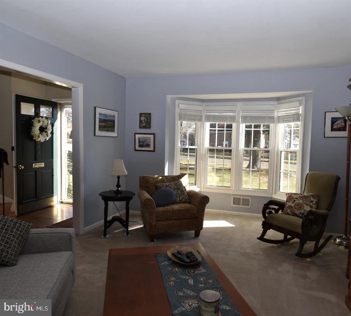 8244 Carrleigh Parkway Springfield, VA 22152 - Photo 2 of 25 a living room with furniture and a large window