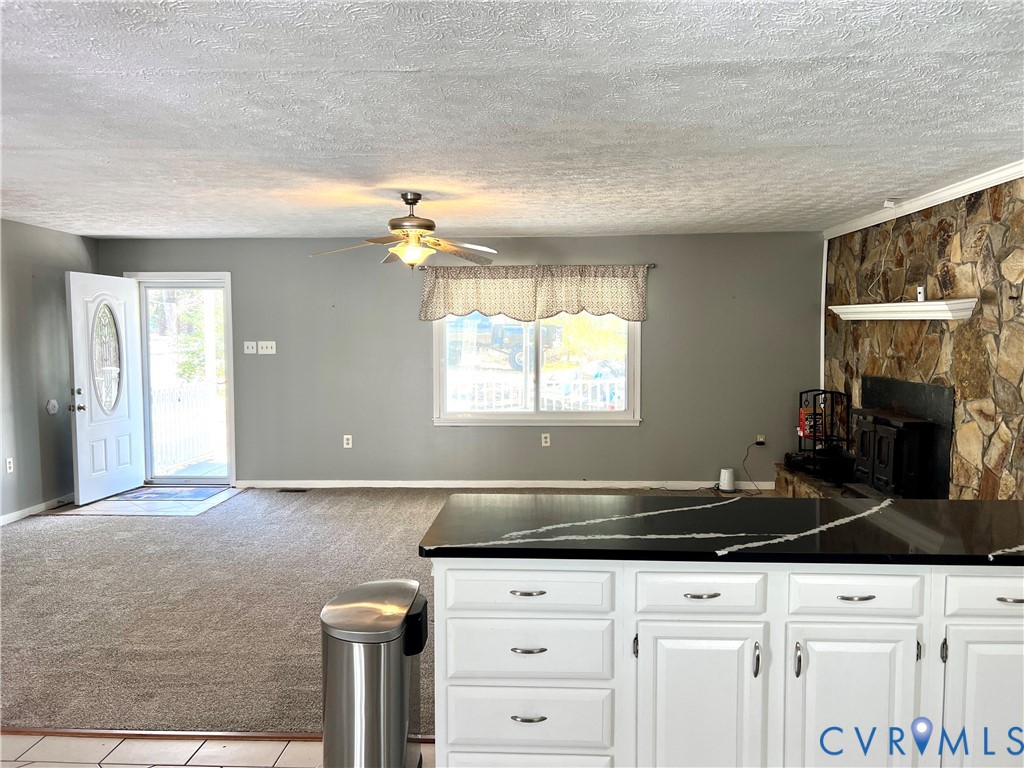 2049 Riddle Road Blackstone, VA 23824 - Photo 11 of 44 a kitchen with granite countertop a stove a sink and a cabinets