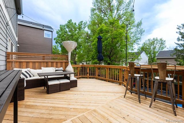 a backyard of a house with sofas