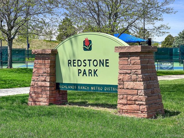 a bench sitting in the middle of a yard