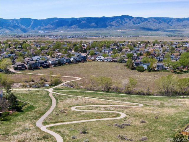a view of a town with large trees