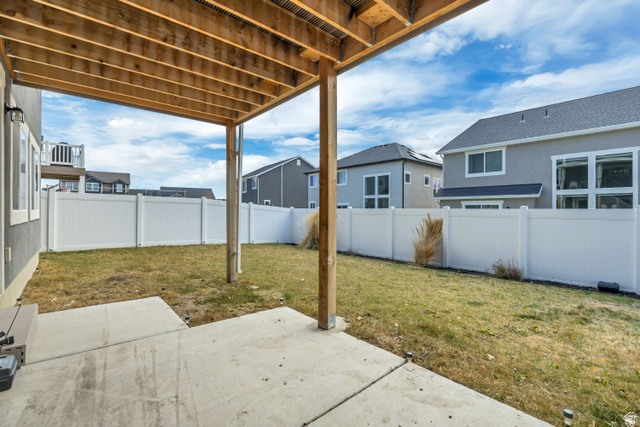 1577 Quailhill Road Saratoga Springs, UT 84045 - Photo 39 of 46 Fenced backyard featuring a patio and a residential view