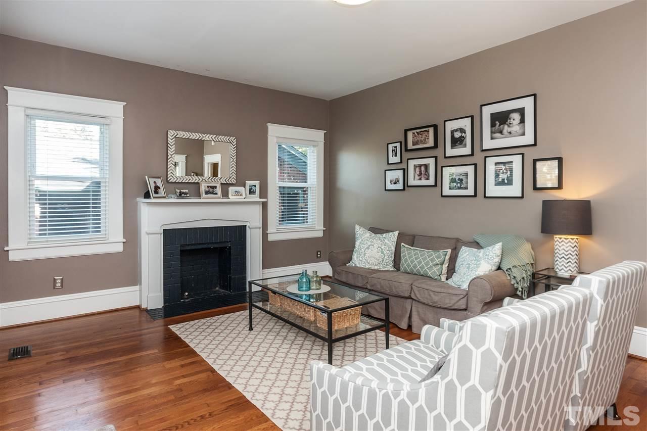 1916 Sunset Drive Raleigh, NC 27608 - Photo 3 of 25 a living room with a couch and a fireplace