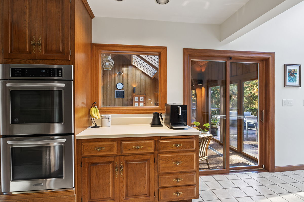 1931 Camphill Circle Inverness, IL 60067 - Photo 17 of 55 a kitchen with stainless steel appliances granite countertop a stove a sink and a microwave